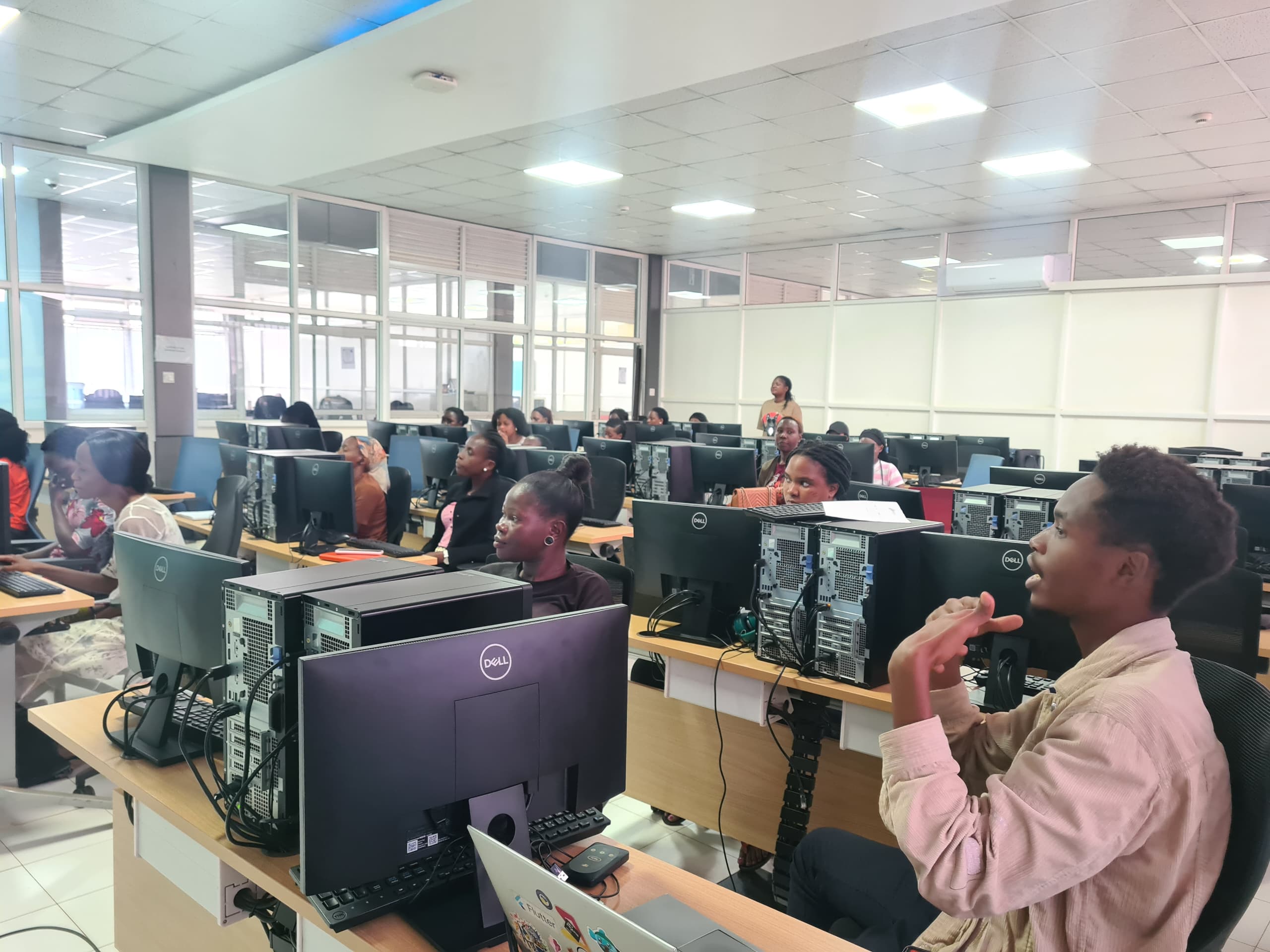 Computer training session with instructor and students